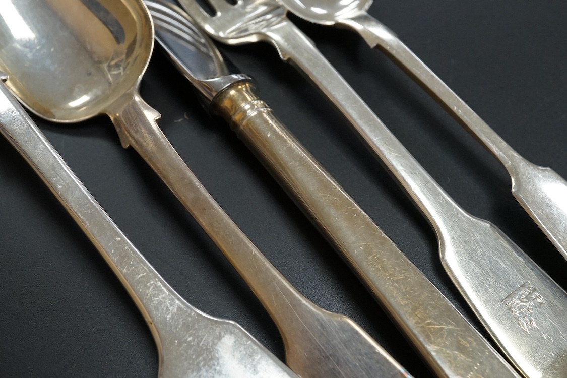 A harlequin part canteen of 19th century silver fiddle pattern flatware, comprising fifty four items, various dates and makers including twelve table spoons, twelve table forks and six dessert spoons with engraved initia